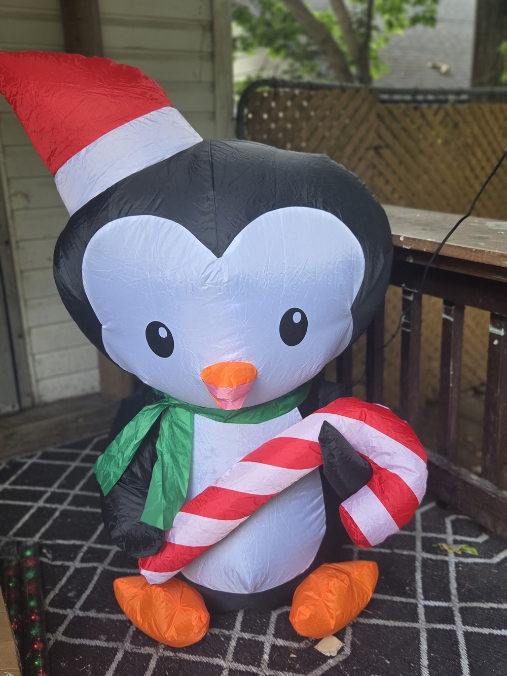 Inflatable Black & White Penguin Holiday Decoration with Red Candy Cane